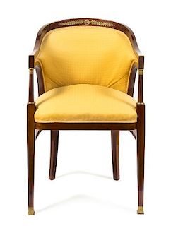 An Empire Style Gilt Bronze Mounted Mahogany Bergere, Height 33 3/4 inches.