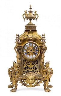 A French Gilt Bronze and Porcelain Inset Mantel Clock, 19TH CENTURY, Height 28 x width 12 x depth 9 inches.