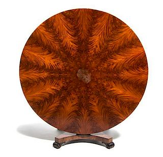 An Empire Mahogany Center Table, 19TH CENTURY, Height 29 1/2 x diameter 60 inches.