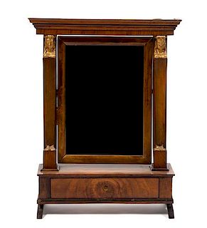 An Empire Mahogany and Parcel Gilt Dressing Mirror, Height 22 1/2 x width 15 1/2 x depth 6 inches.