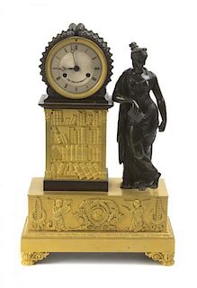 An Empire Style Gilt and Patinated Bronze Figural Mantel Clock, Height 17 1/2 inches.