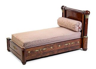 An Empire Style Gilt Metal Mounted Mahogany Daybed, Height 35 x width 60 x depth 37 1/2 inches.