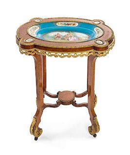 A Sevres Style Porcelain and Gilt Bronze Mounted Burlwood Table, Height 31 1/2 x width 26 x depth 19 inches.