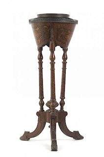 A Napoleon III Style Walnut Jardiniere on Stand, Height 33 1/2 x diameter 13 inches.