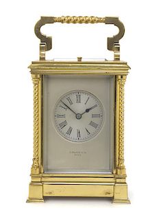 A French Brass Carriage Clock, E. MAURICE & CO, PARIS, Height 5 3/8 inches.