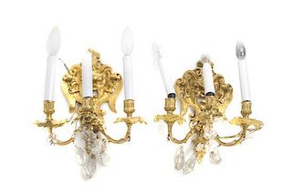 A Pair of Gilt Bronze and Rock Crystal Three-Light Sconces, Height 11 inches.