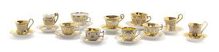 Eighteen German Gilt Porcelain Teacups and Saucers, Various sizes.