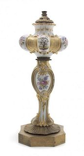 A German Porcelain Oil Lamp Base, Height overall 31 inches.