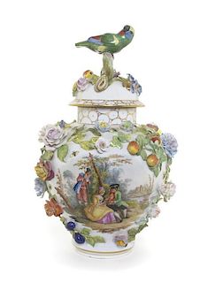 A German Porcelain Urn and Cover, Height overall 16 5/8 inches.