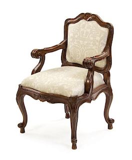 A Continental Walnut Fauteuil, Height 35 1/2 inches.