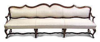 A Continental Walnut Settee, Width 101 inches.