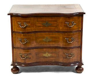 A German Walnut Commode, Height 32 1/2 x width 38 x depth 24 inches.