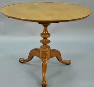 Chippendale dished top table on pedestal base having tripod base and ball and claw feet. ht. 30in., dia. 37 1/2in.