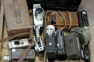 Two box lots: Group lot of movie cameras including Filmo model 70, Super 8, Reg 8, Nikon Super Zoom-8, and Kodak Cine Special