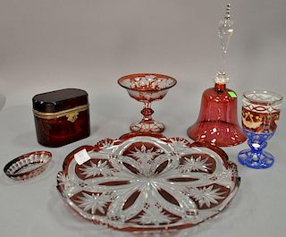 Six crystal pieces to include white, ruby, and blue cut to clear glass, large ruby cut to clear circular tray (dia. 13 3/4in.