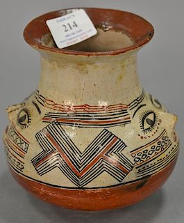 Indian pottery vase, possibly Shipibo polychrome with a face on each side. ht. 6in.