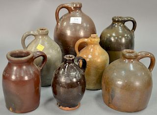 Group of seven stoneware and redware jugs. ht. 5 1/2in. to 10in.