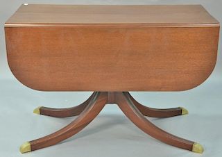 Mahogany Duncan Phyfe style drop leaf table with three 15 inch leaves. ht. 30in., top: 22" x 45", top open: 45" x 82"