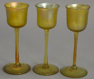 Set of three Tiffany Favrile iridescent glass intaglio cordial stem glasses, marked LCT. ht. 4 3/4in.