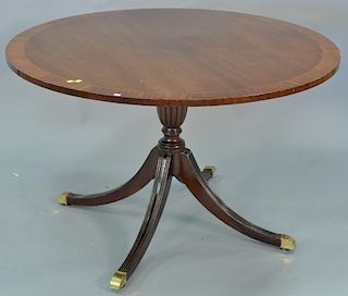 Councill mahogany round pedestal table with banded inlaid top. ht. 29in., dia. 48in.