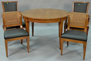 Five piece dining set including fruitwood dining table with two 18inch leaves and four chairs. table: ht. 30in., dia. 45in., 