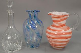 Three piece lot to include Waterford crystal decanter, blue and clear art glass vase, and an art glass pitcher. ht. 9 1/2in. 