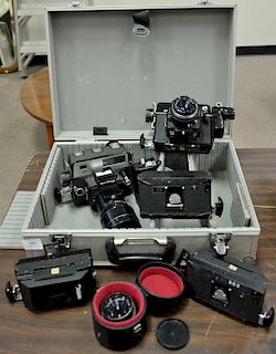 Seven piece camera and case lot including Omega Rapid 100 with 90/3.5, Koni Omega Rapid with 80/4.5m, three Rapid film backs,