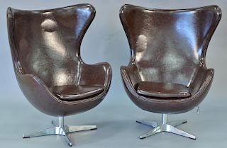 Pair of swivel egg chairs, Arne Jacobsen style, adjustable.