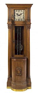 A Gustav Becker Oak Tall Case Clock, Height 74 3/4 inches.