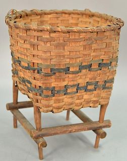 Woven splint basket with light blue paint on stretcher base stand, 19th century. ht. 15 1/2in., dia. 13 1/2in.  Provenance: E