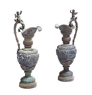 A Pair of Continental Bronze Ewers, Height 38 inches.