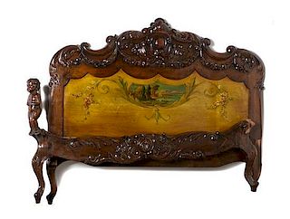 A Continental Carved Bed, 20TH CENTURY, Height of headboard 47 3/4 x width 57 inches.