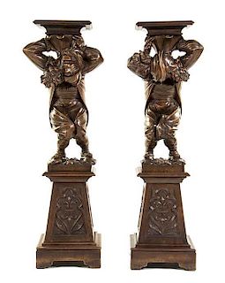 A Pair of Continental Carved Figural Pedestals, Height overall 51 inches.