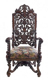 A Renaissance Revival Walnut Open Armchair, Height 52 inches.