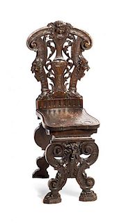 A Renaissance Revival Carved Hall Chair, 19TH CENTURY, Height 38 inches.