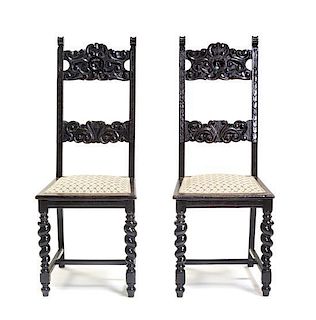 A Pair of Renaissance Revival Hall Chairs, Height 44 1/2 inches.