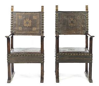 A Pair of Italian Studded Leather and Parcel Gilt Open Armchairs, Height 48 3/4 inches.