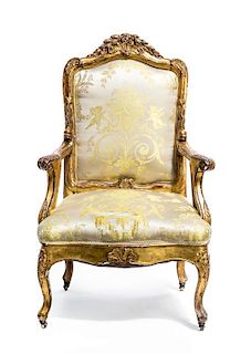 A Continental Giltwood Armchair, LATE 19TH CENTURY, Height 44 inches.