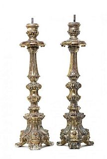 A Pair of Continental Painted and Parcel Gilt Pricket Sticks, 18TH CENTURY, Height 22 3/4 inches.