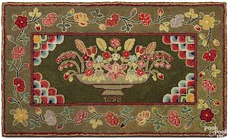 American hooked rug, dated 1898, of a compote of flowers, 34'' x 58''.