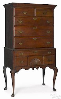 New England Queen Anne walnut high chest, ca. 1765, the lower section with a fan carved drawer, a