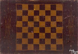Painted double-sided checkerboard, 19th c., retaining its original polychrome surface, 20 7/8'' x 1