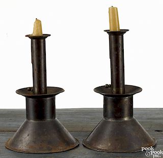 Near pair of weighted tin push-up candlesticks, 19th c., 9'' h. and 9 1/4'' h.
