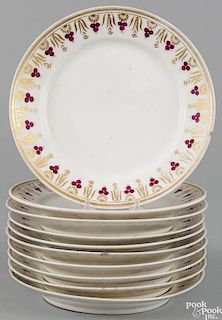 Set of ten porcelain plates, ca. 1830, probably Tucker, with gilt and berry decorated rims, 9 1/4''