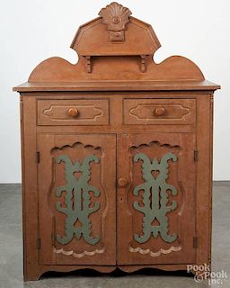 Pennsylvania painted pine jelly cupboard, late 19th c., with applied cutouts to door panels, 67'' h.,
