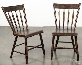 Pair of Pennsylvania painted plank seat chairs, 19th c., with bird and fruit stenciled crest, overal