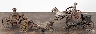 Three cast iron horse drawn toys, 19th c., to include a fire pumper, 12 1/2'' l., a sulkie, 8 1/2'' l.