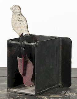 Painted cast iron revolving bird target, ca. 1900, 12'' x 8 1/4''.