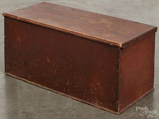 Pennsylvania painted pine blanket box, 19th c., retaining the original red surface, 15'' h., 32 1/2''