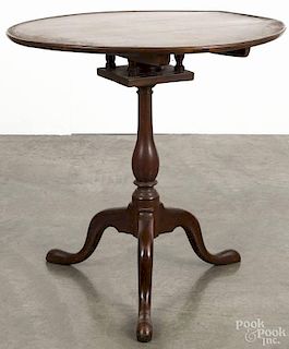 Pennsylvania Chippendale walnut tea table, ca. 1780, with a dish top over a birdcage support, 30'' h.